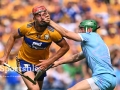 Peter Duggan of Clare is fouled by Limerick goalkeeper Nickie Quaid during the All Ireland SHC semi-final