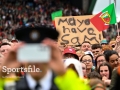 A general view of some of the crowd as a member of an Garda Síochána records a video of players on stage during the homecoming celebrations of the All-Ireland Senior Football Champions